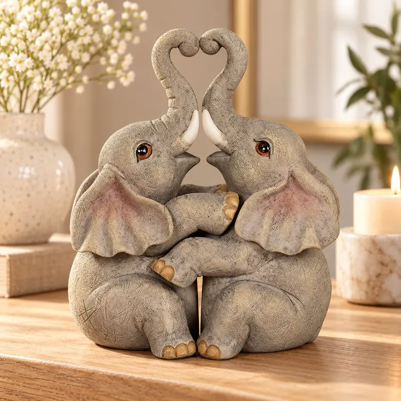 Statuette de deux éléphants enlacés, trompes formant un cœur